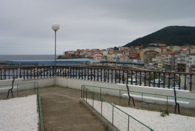 View looking down on the port and portside bay area of Finisterre